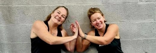 Women giving high fives after training